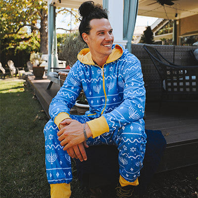 shop hanukkah - image of model wearing men's blue hanukka jumpsuit